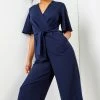 Roman Navy Blue Angel Sleeve Wrap Jumpsuit 1 Roman Navy Blue Angel Sleeve Wrap Jumpsuit -Roman Sales Shop unnamed file 11330