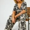 Roman Black & White Curve Tropical Print Jumpsuit 2 Roman Black & White Curve Tropical Print Jumpsuit -Roman Sales Shop unnamed file 11428
