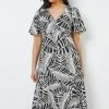Roman Black & White Petite Leaf Print Flute Sleeve Dress 1 Roman Black & White Petite Leaf Print Flute Sleeve Dress -Roman Sales Shop unnamed file 3847