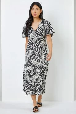 Roman Black & White Petite Leaf Print Flute Sleeve Dress 9 Roman Black & White Petite Leaf Print Flute Sleeve Dress -Roman Sales Shop unnamed file 3849
